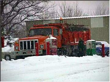 Stamp sand truck