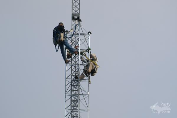 Men working UP high